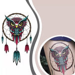 Owl holding dreamcatcher tattoo